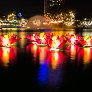 Vesak medium-vecteezy_ai-generated-buddhist-monks-engaging-near-serene-buddha_38448739_medium