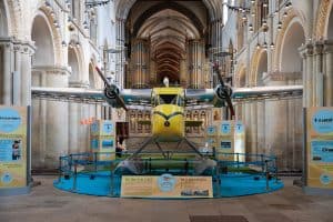 Wing and prayer: restored aircraft lands in cathedral nave